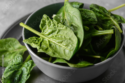 Bowl with fresh spinach leaves  closeup