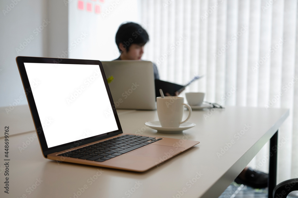 Mock up computer laptop and coffee cup on white office desk. Mock up computer laptop and coffee cup on white office desk.