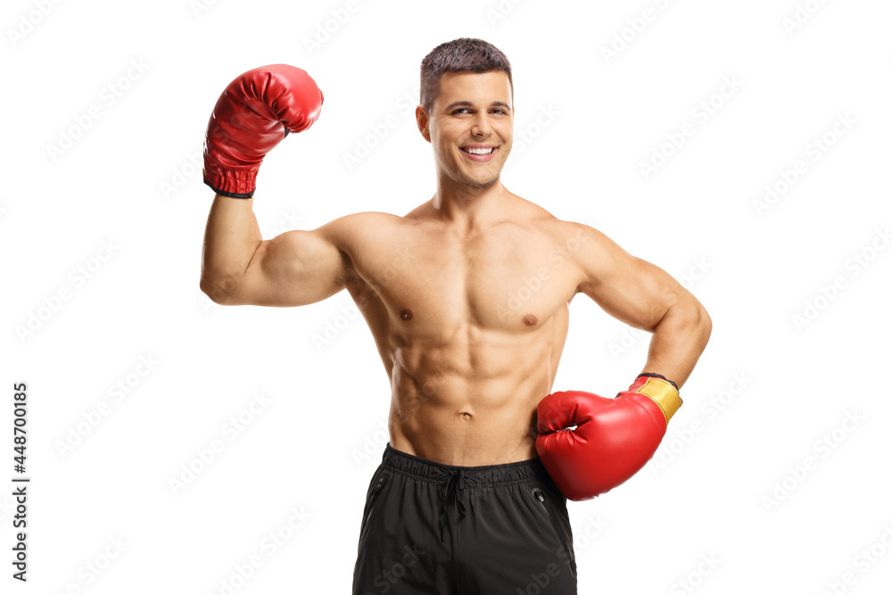 Smiling boxer with red gloves gesturing win with his hand