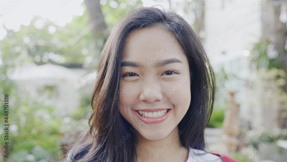 Face Beautiful Asian teenage woman smiling happy. good mental health positive thinking about lifestyle. good dental health. looking at camera Face Beautiful Asian teenage woman smiling happy. good mental health positive thinking about lifestyle. good dental health. looking at camera