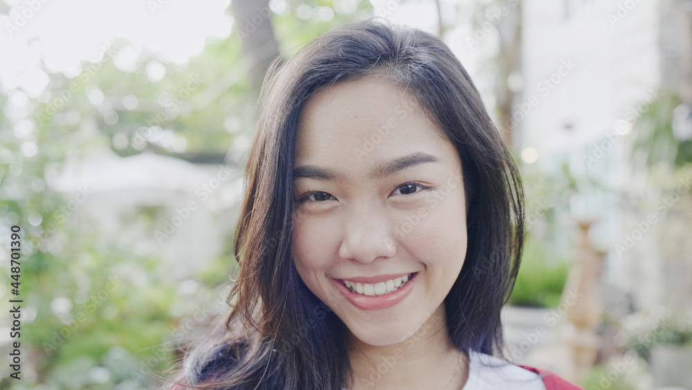 Face Beautiful Asian teenage woman smiling happy. good mental health positive thinking about lifestyle. good dental health. looking at camera Face Beautiful Asian teenage woman smiling happy. good mental health positive thinking about lifestyle. good dental health. looking at camera