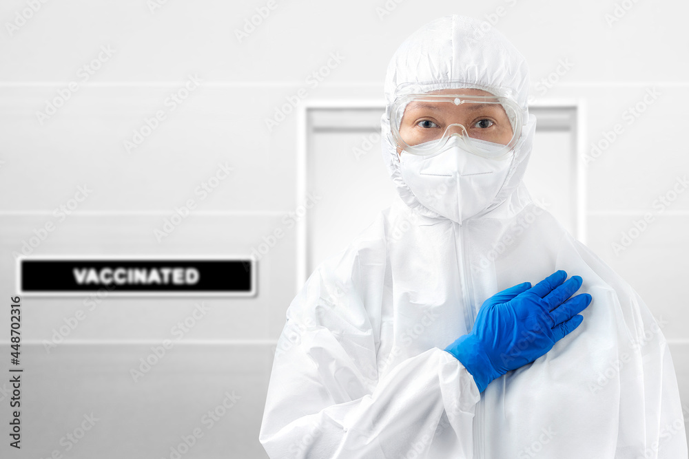 Health worker woman with a protective suit and gloves standing Health worker woman with a protective suit and gloves standing