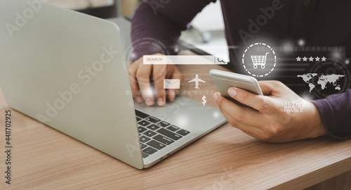 Human using mobile phone with laptop. Ideas about customers order buy from retailer sites via the internet website.Online shopping, ecommerce and delivery service, marketing system in global network .