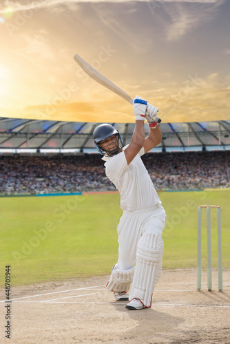 Foto Cricketer batsman hitting a shot