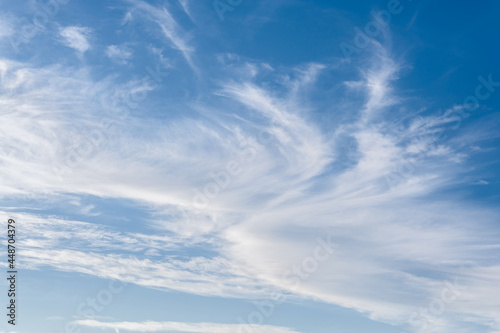 Fototapeta Naklejka Na Ścianę i Meble -  White clouds dance in the blue sky