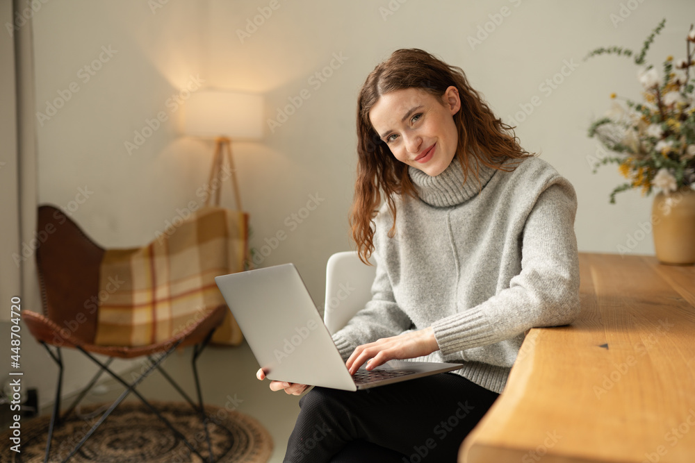 Friendly thoughtful young woman looking quietly at the camera Friendly thoughtful young woman looking quietly at the camera