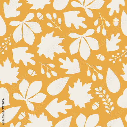 Autumn seamless pattern with colorful silhouette acorns, leaves and berries on orange background. Modern seasonal pattern. Vector flat design 
