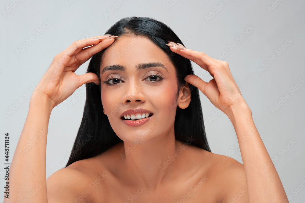 Portrait of a young woman with clear,spotless skin smiling. Portrait of a young woman with clear,spotless skin smiling.