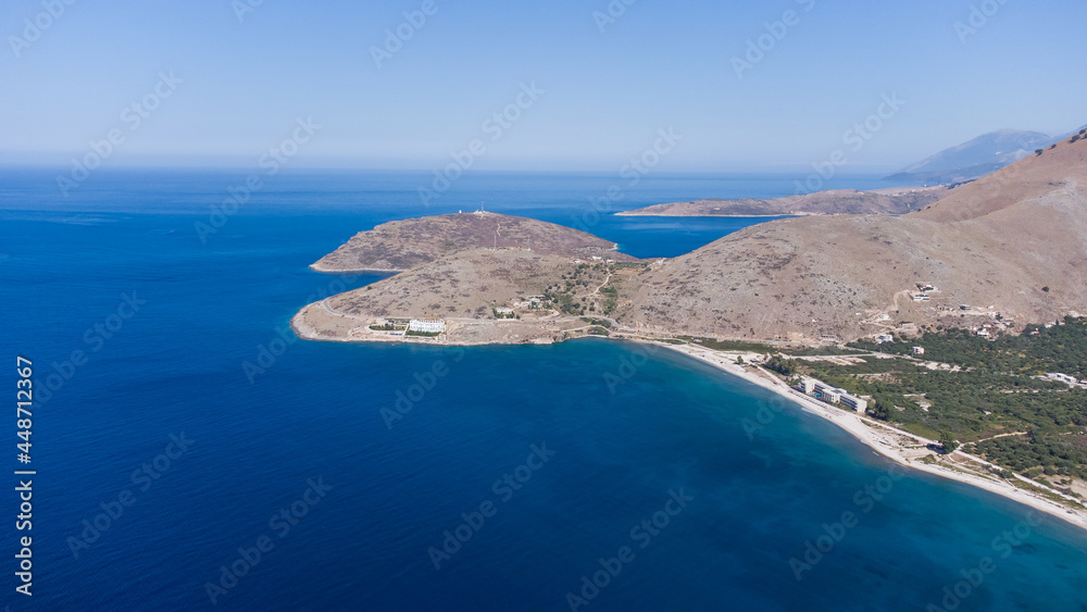 Typical Albanian landscape on the Adriatic shore with mountains. Sunny morning in Albania, Europe. Traveling concept background.