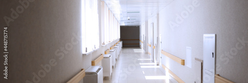 Light empty spacious corridor in medical facility