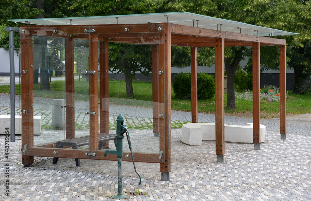 wooden structure of the bus stop, the shelter of the gazebo pergola. the  roof and walls