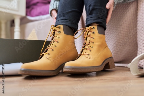 Autumn winter season  new shoes  close-up woman shoeing warm boots