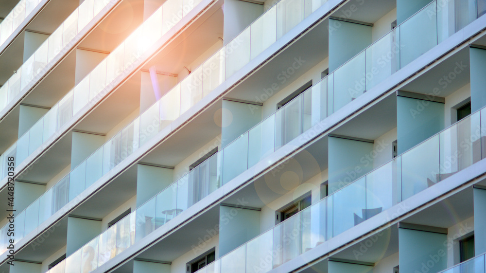 New apartment building with glass balconies. Modern architecture houses by the sea. Large glazing on the facade of the building. New apartment building with glass balconies. Modern architecture houses by the sea. Large glazing on the facade of the building.
