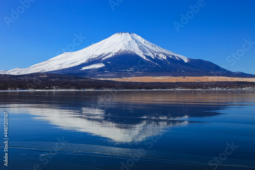 Beautiful Mount Fuji and Lake Yamanaka with Nature background and blue sky in winter.  japan.