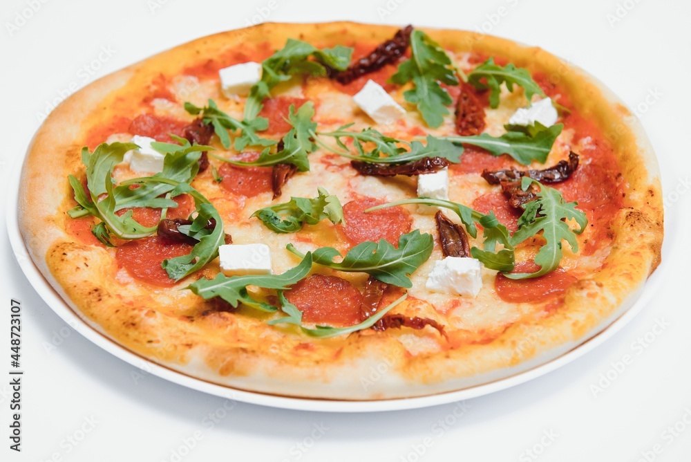 Delicious italian pizza over white background top view Delicious italian pizza over white background top view