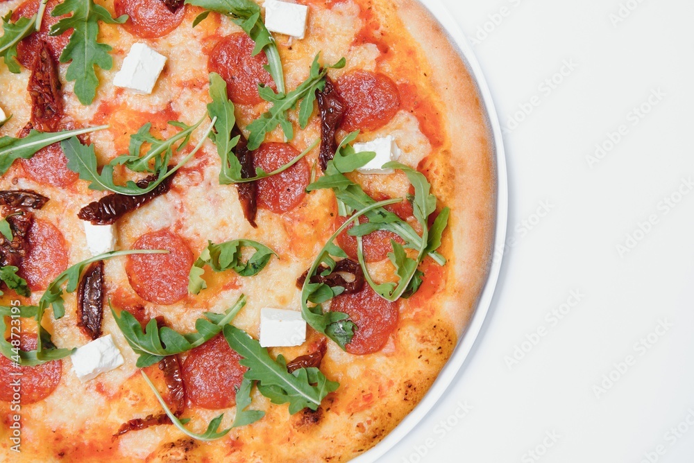Delicious italian pizza over white background top view Delicious italian pizza over white background top view