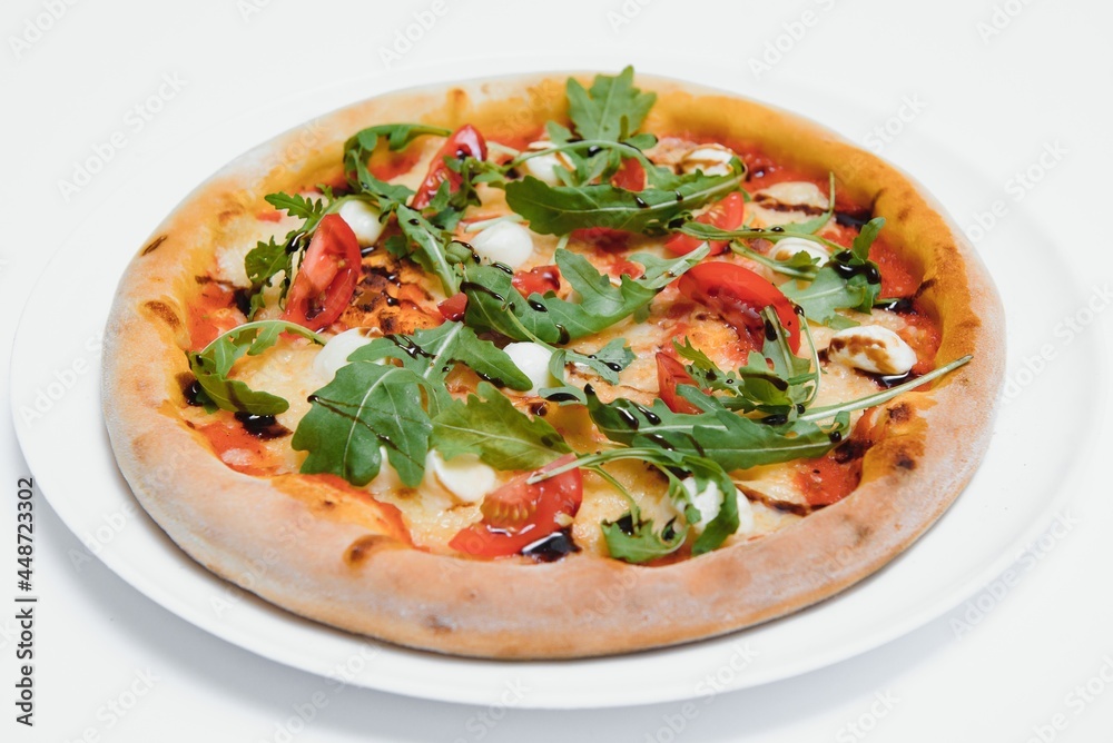 Delicious italian pizza over white background top view