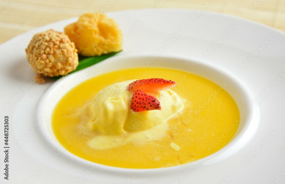 chilled mango pudding with mango puree soup dessert in white background asian halal menu chilled mango pudding with mango puree soup dessert in white background asian halal menu