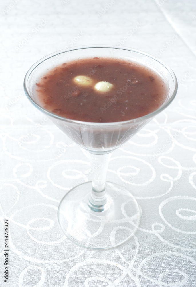 chilled red bean paste soup in cocktail glass in white background asian halal menu chilled red bean paste soup in cocktail glass in white background asian halal menu