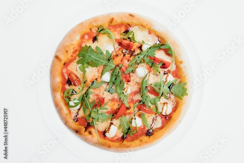 Delicious italian pizza over white background top view