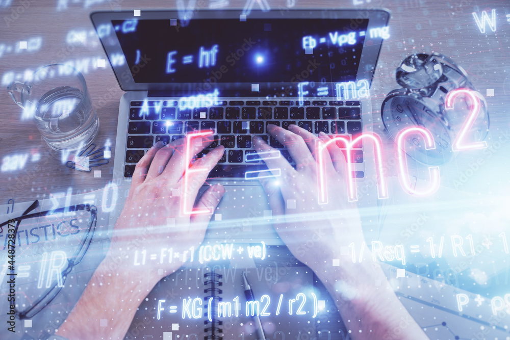 Double exposure of man's hands typing over computer keyboard and formula hologram drawing. Top view. Education concept. Double exposure of man's hands typing over computer keyboard and formula hologram drawing. Top view. Education concept.