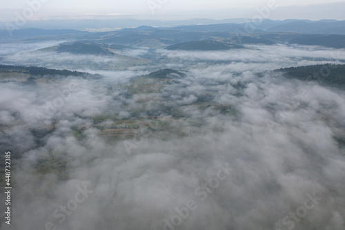 Aerial view on mountains in clouds from drone