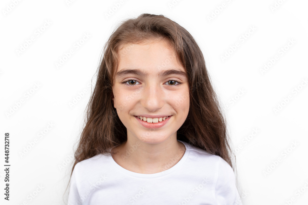 Happy girl standing, smiling isolated on white studio background Happy girl standing, smiling isolated on white studio background