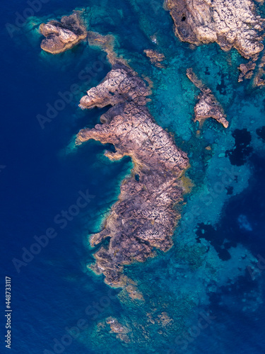 aerial view of some rocks in the sea