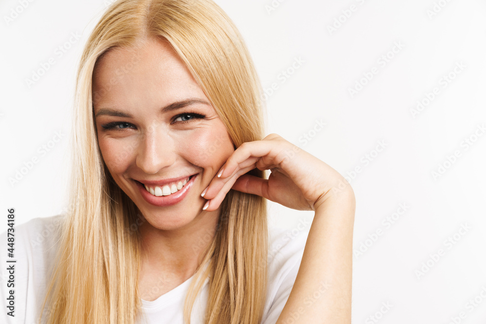 Young blonde woman in t-shirt laughing and looking at camera Young blonde woman in t-shirt laughing and looking at camera