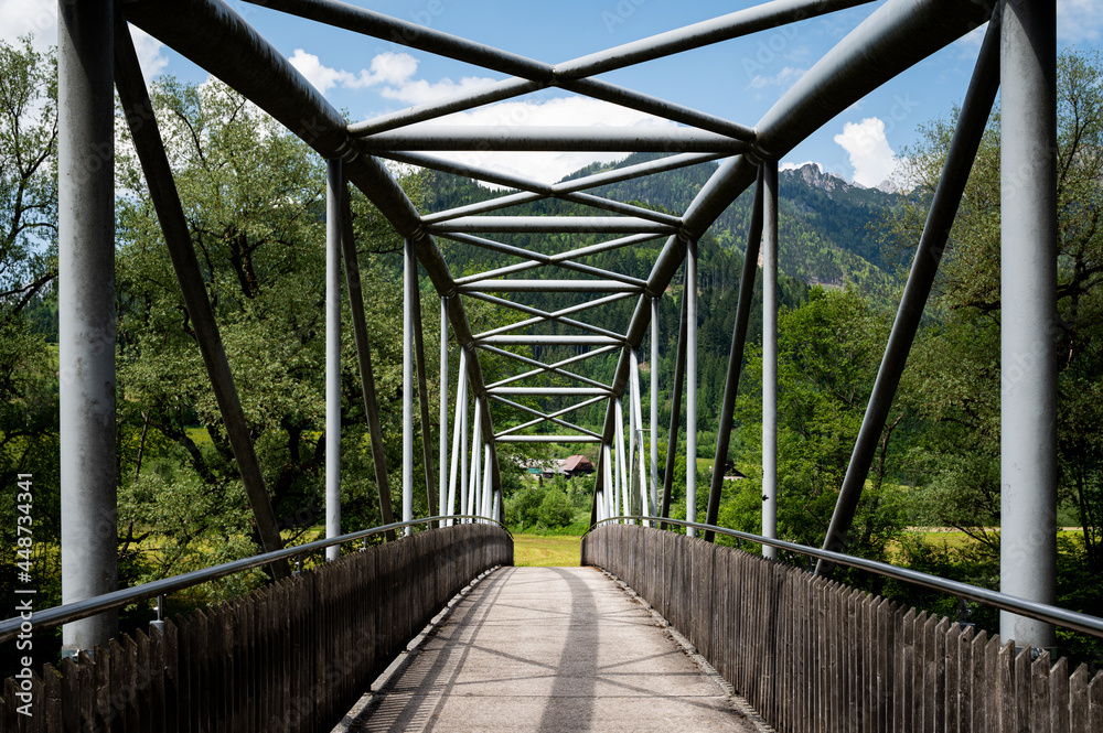 Obraz premium Small bridge across river Enns near Admont