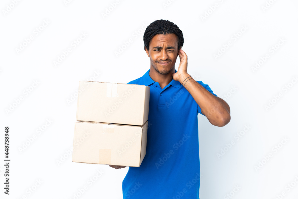 Delivery African American man with braids isolated on white background frustrated and covering ears Delivery African American man with braids isolated on white background frustrated and covering ears