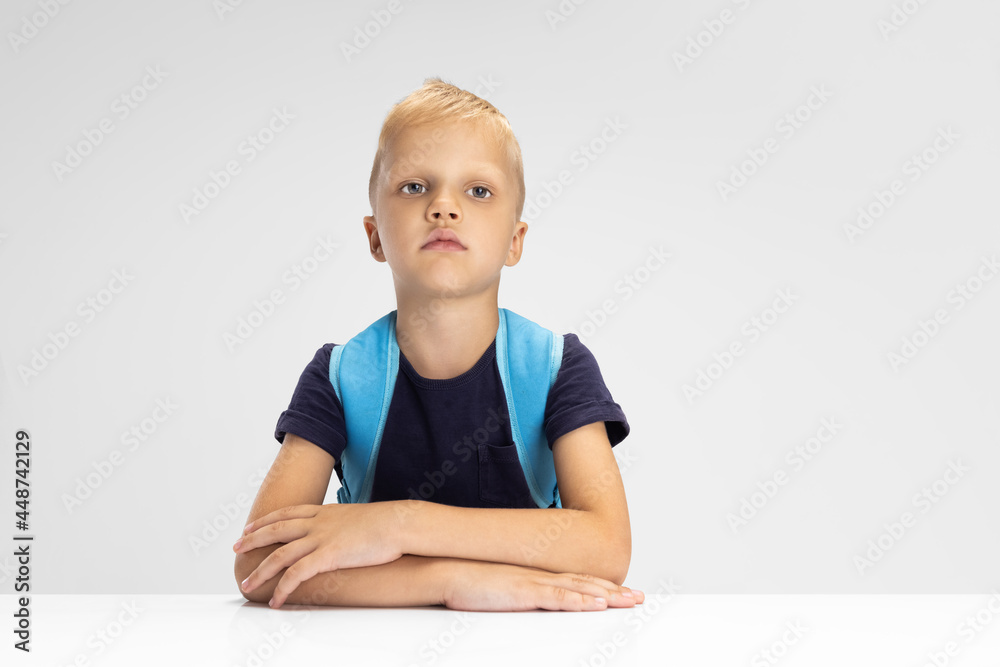 Close-up Caucasian preschool boy isolated on white studio background. Copyspace for ad. Childhood, education, emotion concept Close-up Caucasian preschool boy isolated on white studio background. Copyspace for ad. Childhood, education, emotion concept