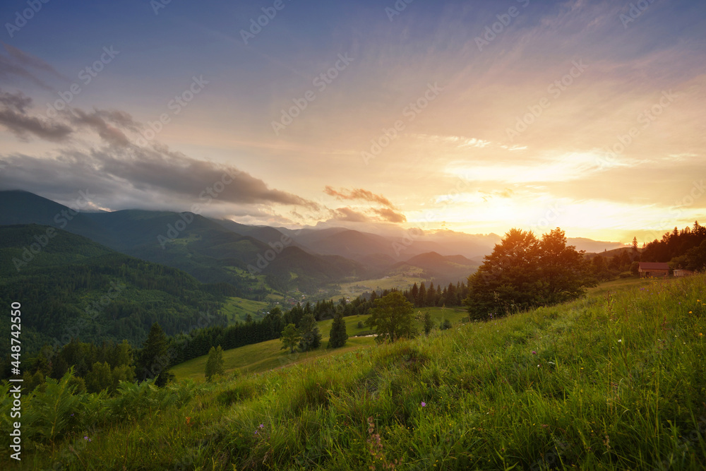 Beautiful summer sunset scene in the mountains with spectacular sky. Mystical landscape. Location place Carpathian mountains, Ukraine, Europe.