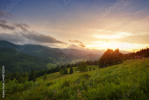 Beautiful summer sunset scene in the mountains with spectacular sky. Mystical landscape. Location place Carpathian mountains, Ukraine, Europe.