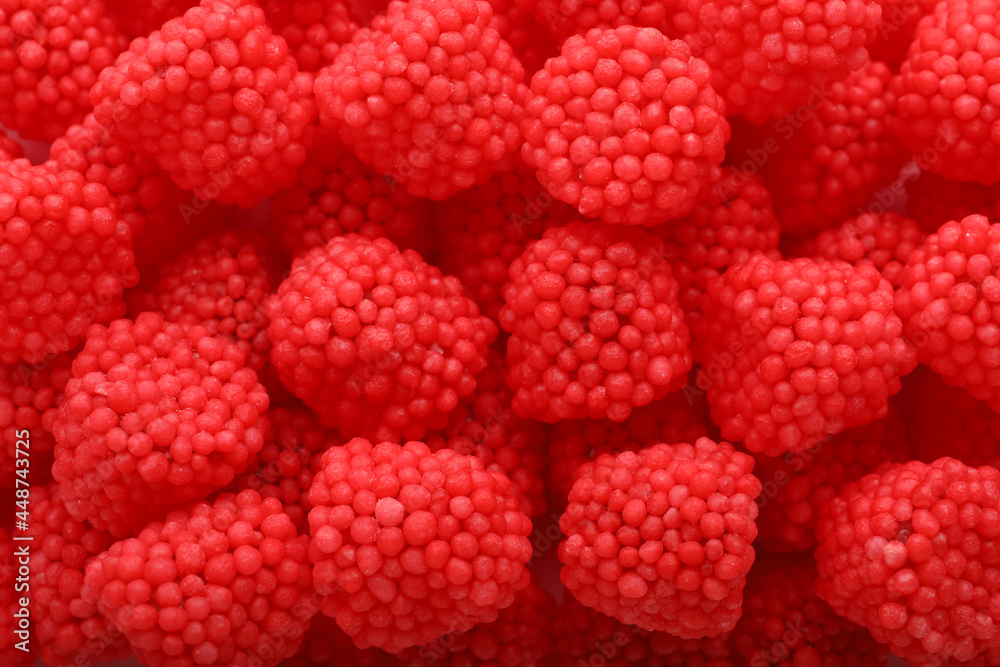 Delicious gummy raspberry candies as background, top view Delicious gummy raspberry candies as background, top view