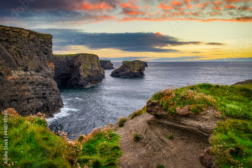 Rocky cliffs in Kilkee at sunset  County Clare. Ireland.