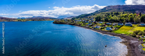 An panorama aerial view along the southern shore of Portree on the Isle of Skye, Scotland on a summers day photo