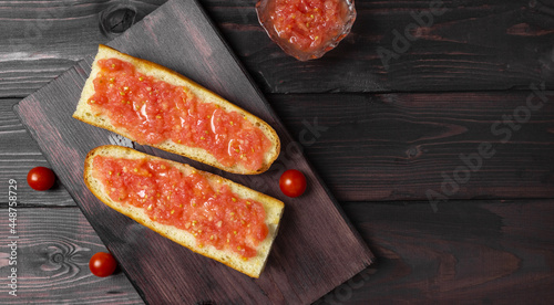 Toast with tomato, traditional Spanish breakfast. Olive oil, top view. Pan tumaka