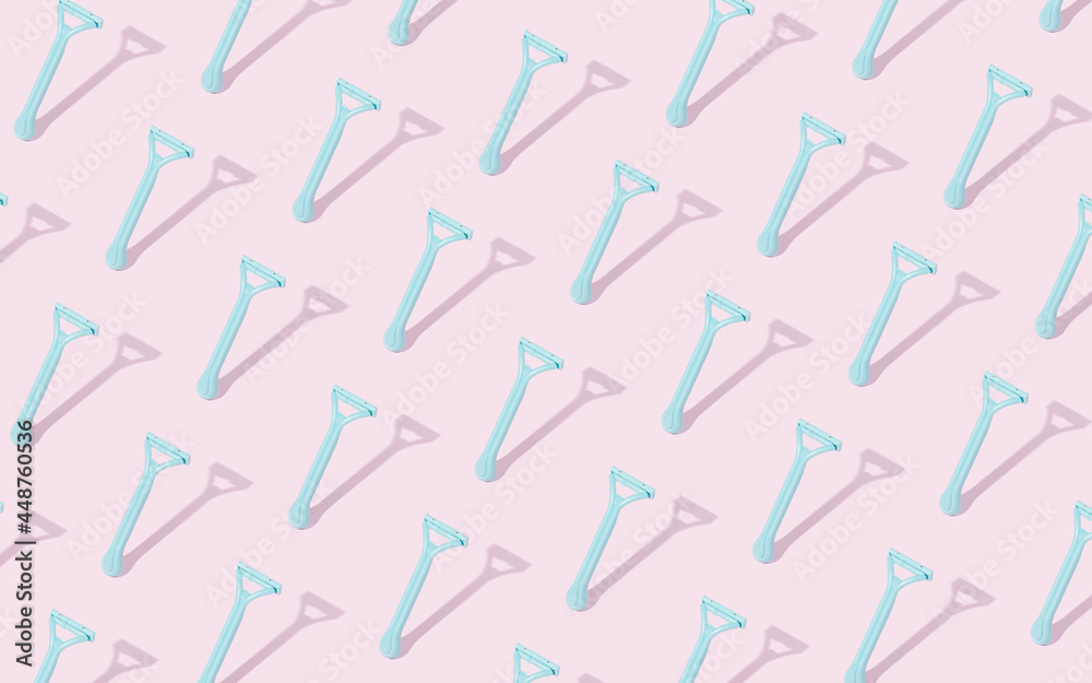 Creative pattern lay out made of plastic beard razor on pastel pink background. Plastic razor for men's shaving. Flat lay. Creative pattern lay out made of plastic beard razor on pastel pink background. Plastic razor for men's shaving. Flat lay.