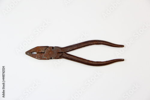 Rusty pliers on a white background