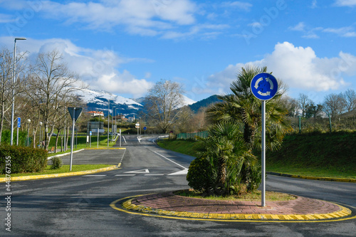 Close-up of a roundabout in Sopuerta, with the snowy mountains in the background photo