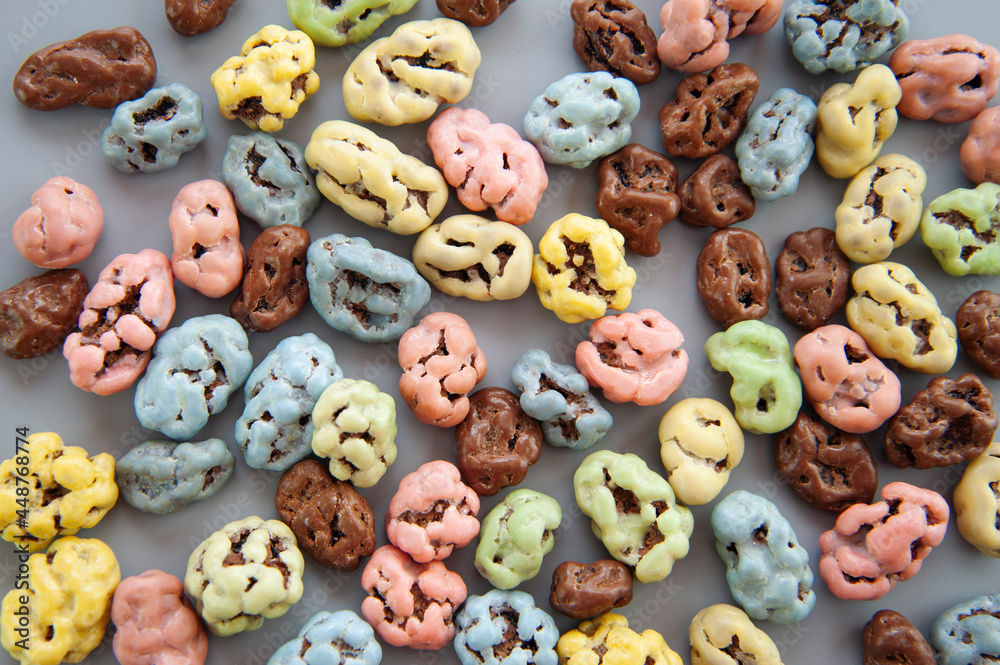 background of colored sweets on a gray background background of colored sweets on a gray background