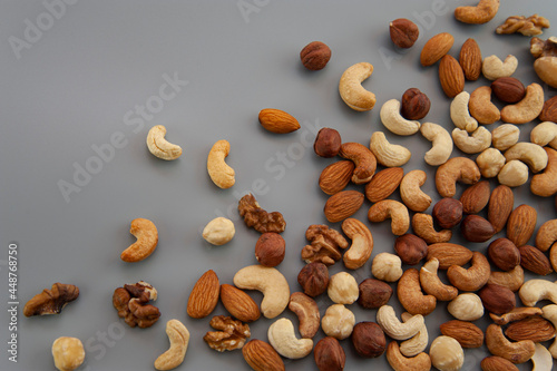 background of assorted nuts on a gray background