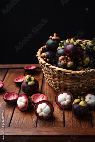 Mangosteen fruit on wooden background photo