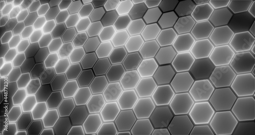 Gray hexagons glowing with white light on a black background. Geometric abstract pattern. Beautiful decorative screensaver.