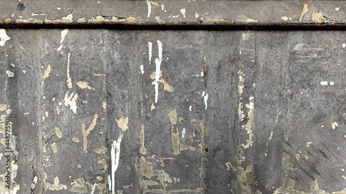 Black metal background with rust and abrasion of paint, raw, rough, rough texture.