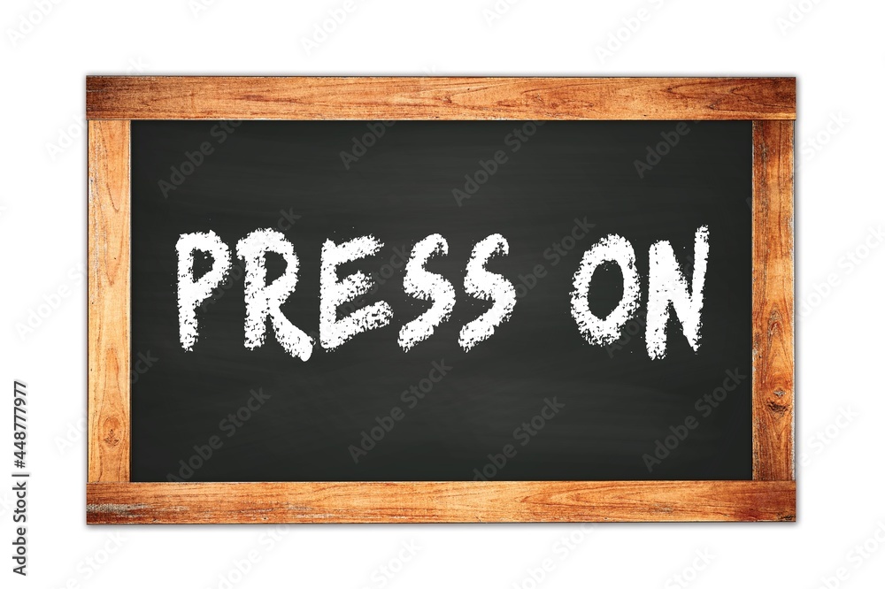 PRESS ON text written on wooden frame school blackboard. PRESS ON text written on wooden frame school blackboard.