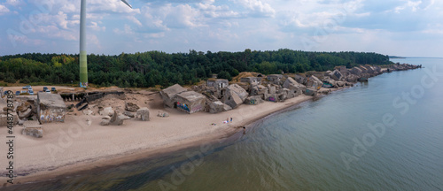 Fototapeta Naklejka Na Ścianę i Meble -  Ruins of bunkers on the beach of the Baltic sea, part of an old fort in the former Soviet base Karosta in Liepaja, Latvia.