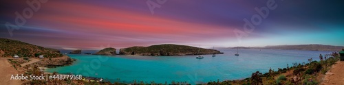 Blue lagoon on Malta island with sunset sky