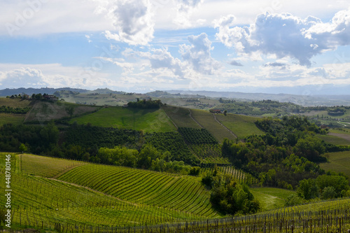 Scenic view of the Langhe vineyard hills, Unesco World Heritage Site, in a cloudy spring day, Cuneo province, Piedmont, Italy